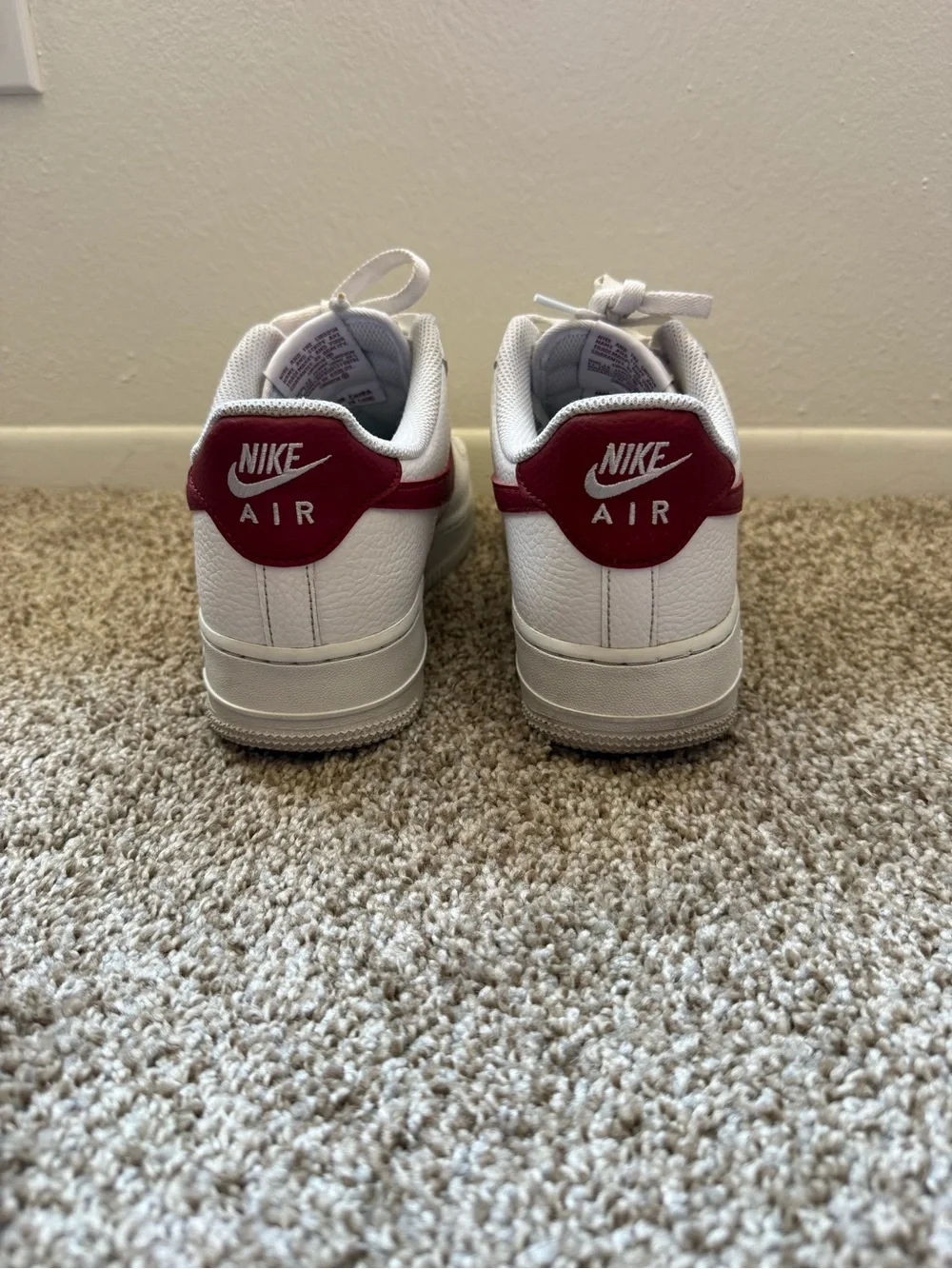 Nike Men’s White Leather Sneakers with Red Swoosh